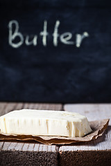 Image showing fresh butter and blackboard 