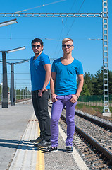 Image showing Two young men standing on the platform