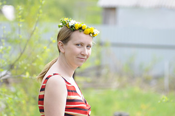 Image showing portrait of the happy woman with a wreath on the head.