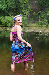Image showing Beautiful woman standing in pond