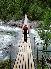 Image showing Man on suspension bridge