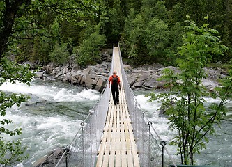 Image showing Man on suspension bridge