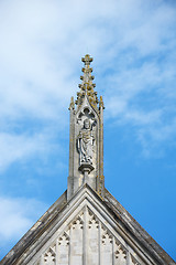 Image showing Stone carving of St. Swithun on top of Winchester Cathedral