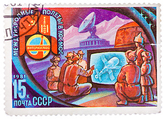 Image showing Stamp printed in USSR shows Intercosmos program - the people of 