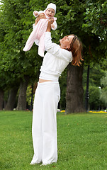 Image showing happy mother with adorable baby