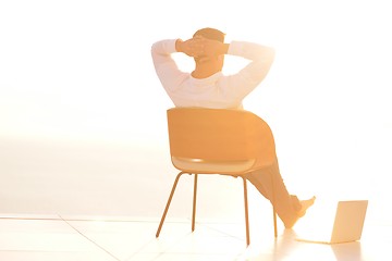 Image showing relaxed young man at home on balcony