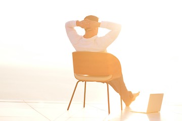 Image showing relaxed young man at home on balcony