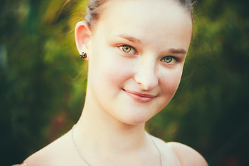 Image showing Portrait Of Face Young Beautiful Girl Woman On Green Outdoor Bac