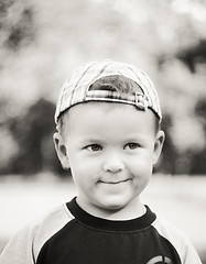 Image showing Happy Child Wearing Striped Cap In Outdoor Portrait