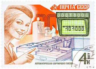 Image showing Stamp printed in USSR, shows mail processing (woman postal offic