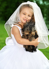 Image showing little bridesmaid with cute dog