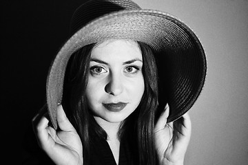 Image showing Charming girl with pink hat black and white