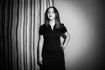 Image showing Young woman posing with linen black and white