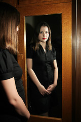 Image showing Girl posing in front of mirror