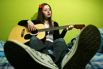 Image showing Girl playing guitar