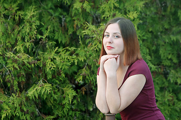 Image showing Brunette leaning on pole