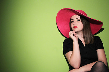 Image showing Young woman wearing pink hat