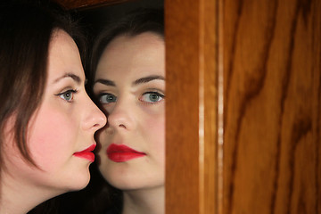 Image showing Woman posing with mirror refection