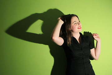 Image showing Woman against green background