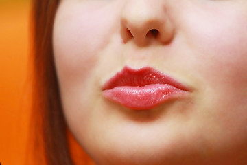Image showing Young woman puckering her lips
