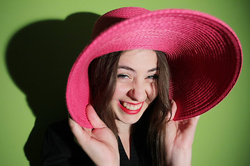 Image showing Girl with pink hat laughing