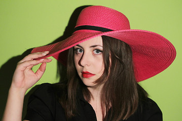 Image showing Girl with pink straw hat