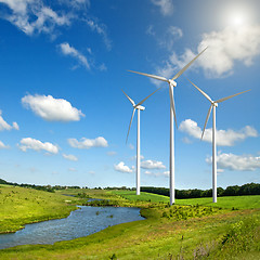 Image showing Wind generators turbines on summer landscape