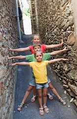 Image showing Funny children on narrow street