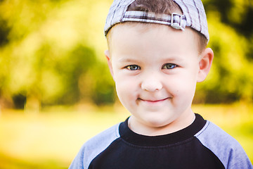 Image showing Happy Child Wearing Striped Cap In Outdoor Portrait