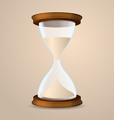 Image showing Vintage hourglass isolated on beige background