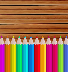 Image showing Palette pencils on wooden background