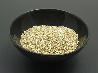 Image showing Bowl of chinaware with quinoa on a dull matting