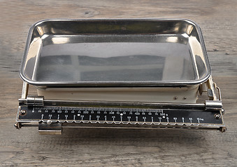 Image showing Old kitchen scales on wood