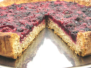 Image showing Cutted berry cake on a cake tray