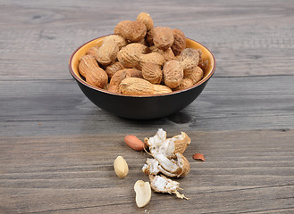 Image showing Peanuts on wood