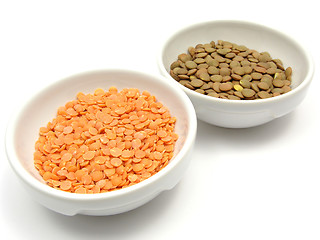 Image showing Two bowls of chinaware with lentils and red lentils