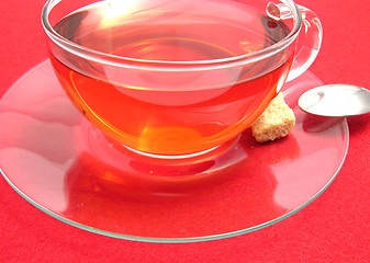 Image showing Tea cup with rose hip tea on a placemat