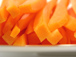 Image showing Julienne carrots on a white plate and white background