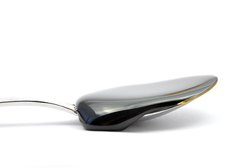 Image showing Sugar beet molasses on spoon