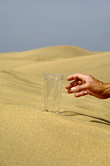 Image showing Hand reaching for water.