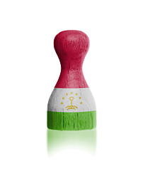 Image showing Wooden pawn with a flag painting