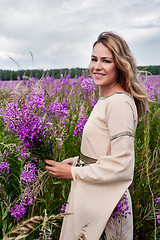 Image showing Beautiful smiling girl on meadow