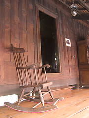 Image showing Rocking chair and teak house