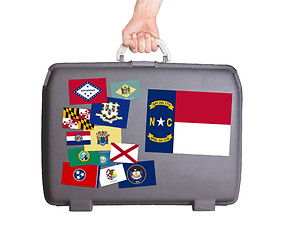 Image showing Used plastic suitcase with stains and scratches