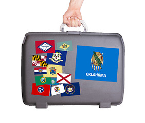 Image showing Used plastic suitcase with stains and scratches