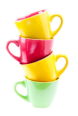 Image showing Yellow, Red, Green Color Cups. Tower Stack Of Clean Different Cu