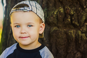 Image showing Happy Child Wearing Striped Cap In Outdoor Portrait