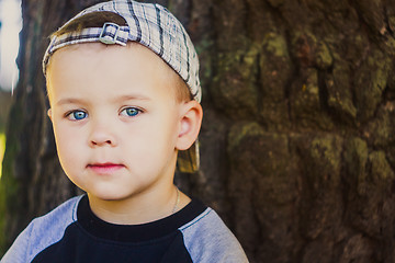 Image showing Happy child wearing striped cap in outdoor portrait