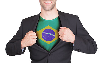 Image showing Businessman opening suit to reveal shirt with flag