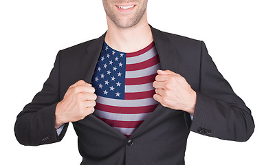 Image showing Businessman opening suit to reveal shirt with flag